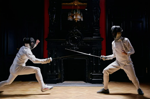 Two Men In Fencing Suit